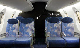 Interior view of the CRJ1000 mockup showing airline seats and the middle aisle